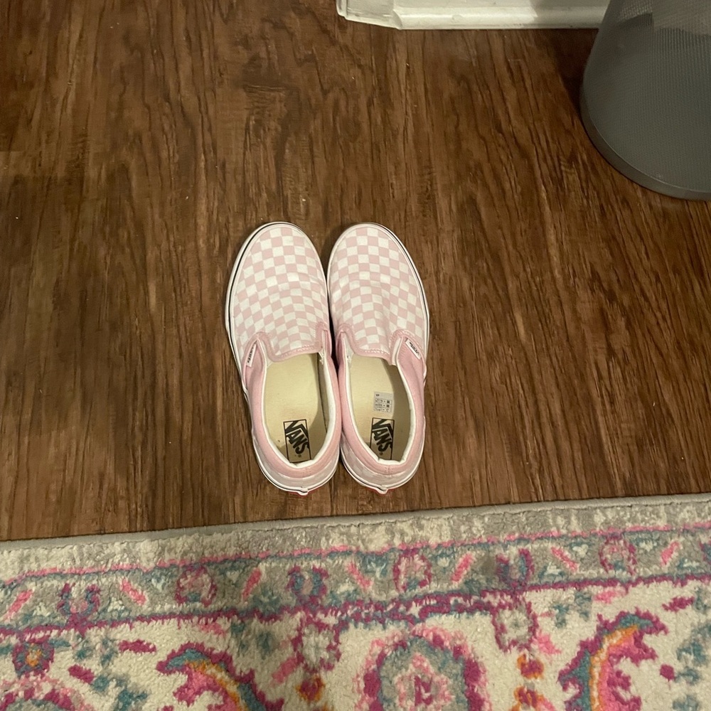 Pink and white checkerboard Vans slip on shoes